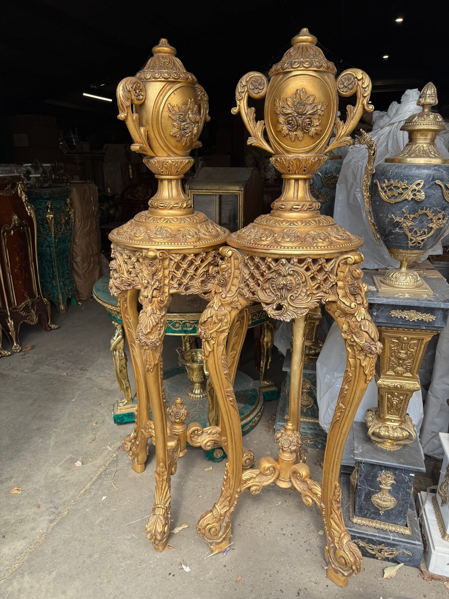 5.5ft tall, french gilt wood urns on stands