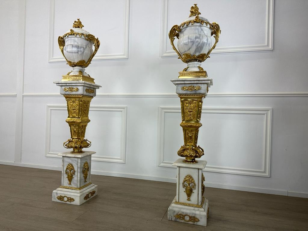 Royal, marble urns on marble stands with bronze ormolu decoration (pair available)