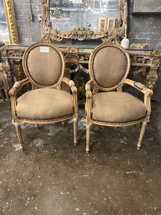 Pair of French, recovered linen arm chairs