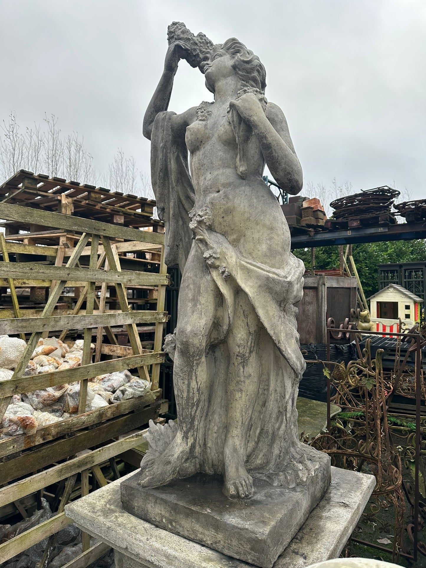 10ft tall, lady on plinth, weathered statue