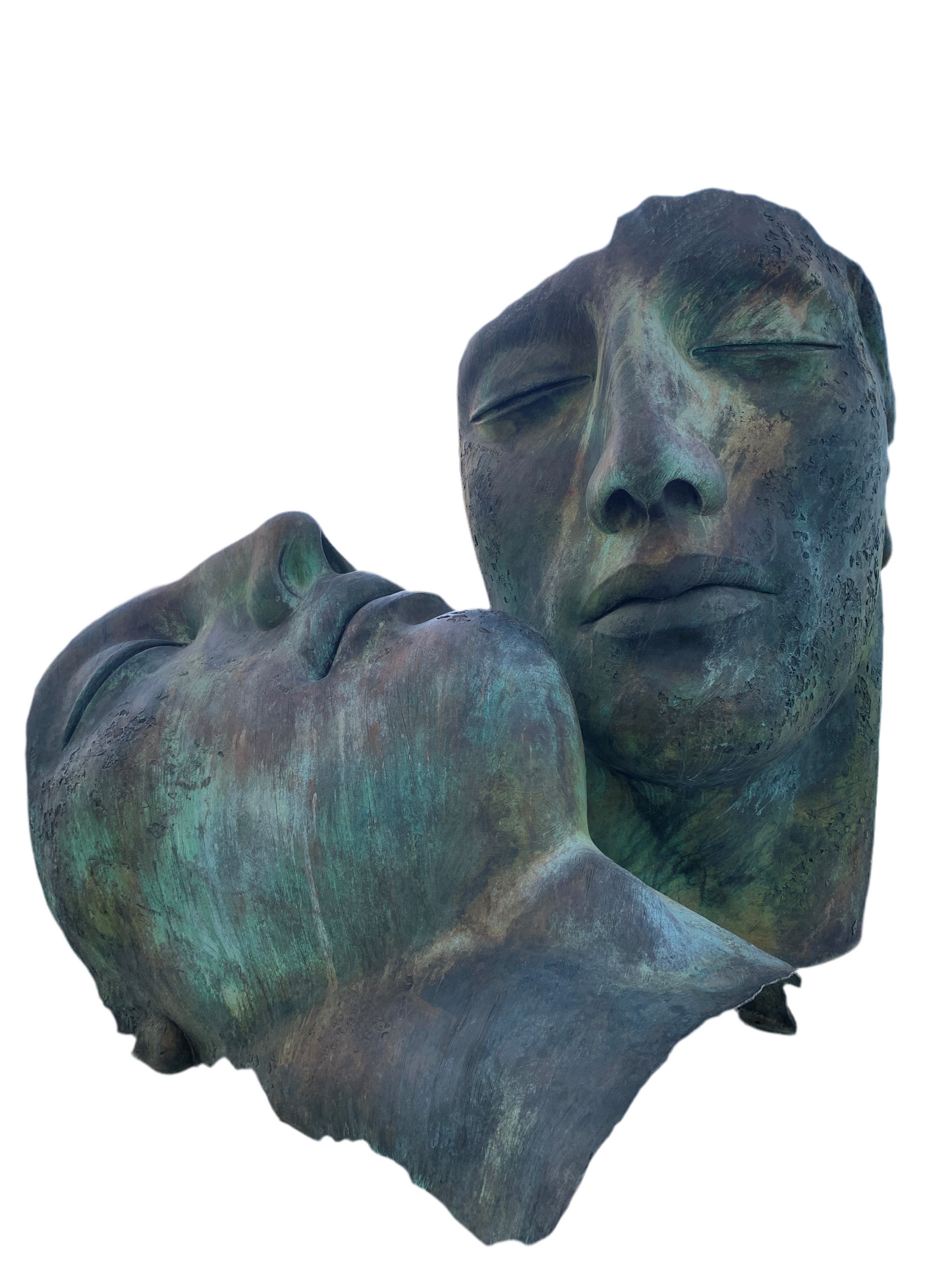 Pair of bronze faces by “Igor Mitoraj”