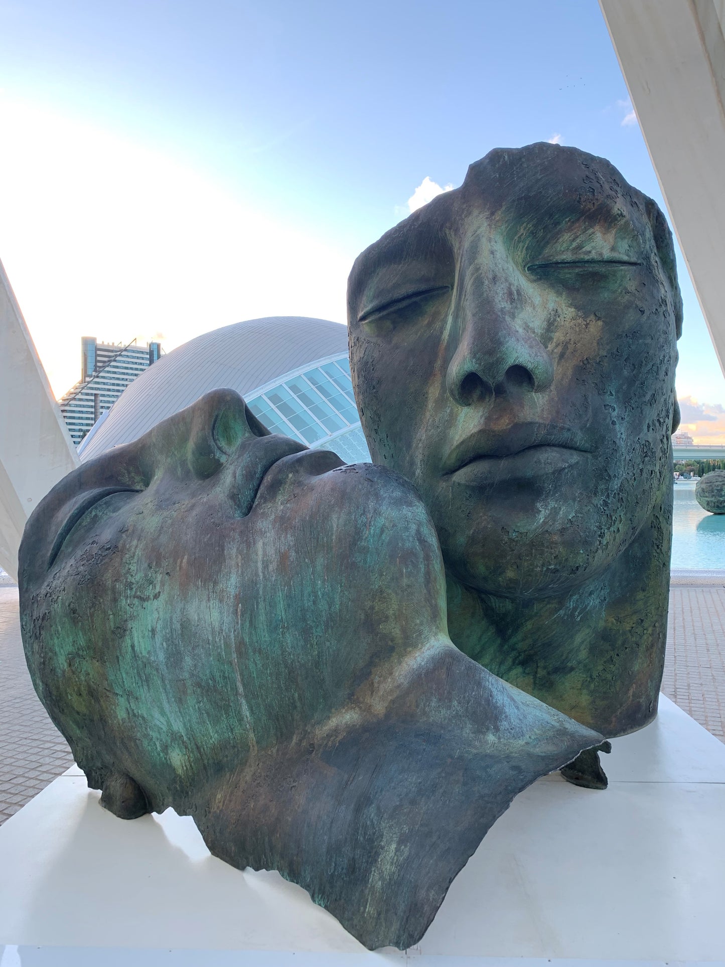 Pair of bronze faces by “Igor Mitoraj”