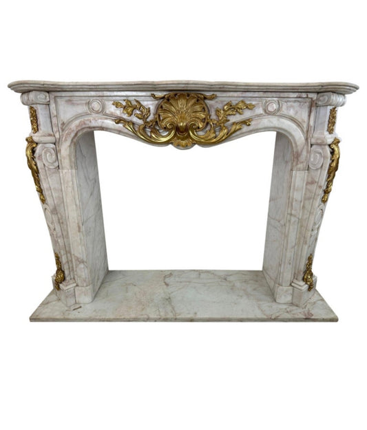 Stunning, rococo white marble fireplace with ormolu detailing